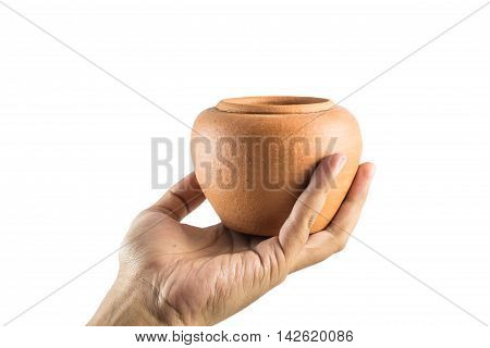 Men's hand holding Earthenware Jur isolate on a white background