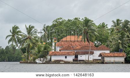Buddhist temple on the river Madu island in Sri Lanka. Bridge to the island with the temple