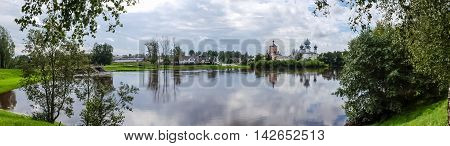 Panorama Tikhvin assumption male monastery, it is the Tikhvin icon of the mother of God. The Orthodox Church of Russia. The temple on the banks of the Tikhvinka river in Tikhvin.