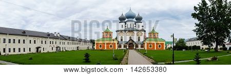 Panorama of Tikhvin assumption male monastery, it is Tikhvin icon of mother of God. The Orthodox Church of Russia. The temple on the banks of the Tikhvinka river in Tikhvin.