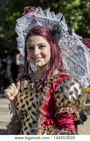 CAGLIARI, ITALY - May 29, 2016: Sunday at La Grande Jatte VIII Ed. At the Public Gardens - Sardinia - portrait of a beautiful smiling girl in Victorian costumes