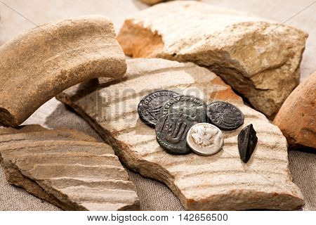 Ancient coins and broken smithers closeup shot