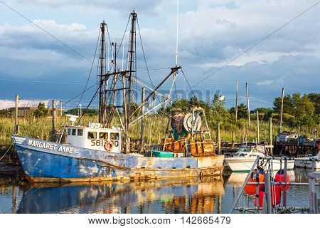MIDDLETOWN NEW JERSEY- AUGUST 6 - Commercial fishing boat on Shoal Harbor on August 6 2016 in Middletown NJ.