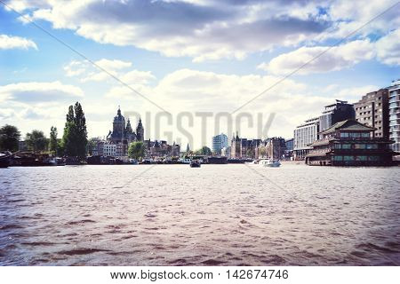 Cityscape of Amsterdam, the Netherlands. View from Amstel river