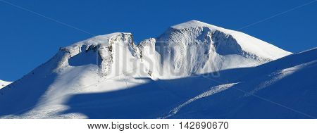Beautiful shaped mountain Chalberstockli. Winter scene in Stoos Swiss Alps. Ski area.