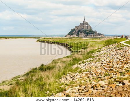 Couesnon river and Mont Saint-Michel - tidal island town and abbey. France