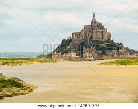 Couesnon river and Mont Saint-Michel - tidal island town and abbey. France