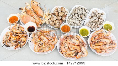 Grilled shrimps shellfish and crabs on the dishes.