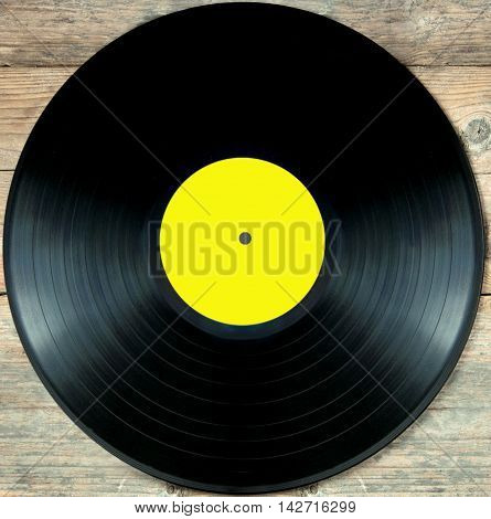 Close up of a vinyl record lp over a white background