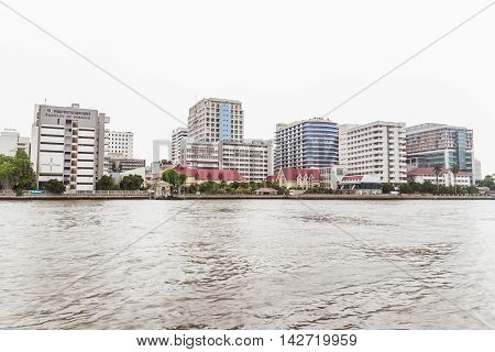 Bangkok, Thailand - June 5, 2016: Siriraj Hospital view from the other side of Chao Phraya River on cloudy day. It is the oldest and the most famous hospital in Thailand and part of Mahidol university