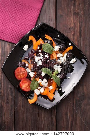 Fresh beetroot salad with sweet pepper, feta cheese and olives