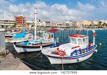 Traditional Greek fishing boats at port of Sitia town on Crete island, Greece
