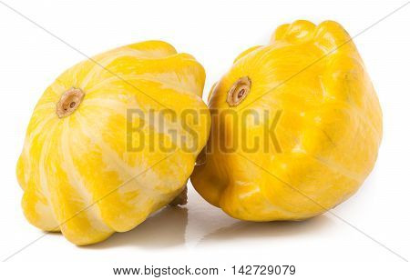 two yellow pattypan squash isolated on white background.