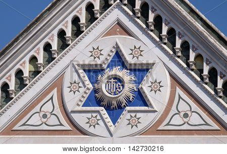 FLORENCE, ITALY - JUNE 05: IHS sign, Basilica di Santa Croce (Basilica of the Holy Cross) - famous Franciscan church in Florence, Italy, on June 05, 2015