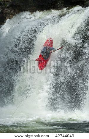 Kayaker in the waterfall in Norway, Ula river.