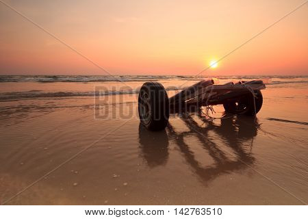 the vehicle on low tide beach when sunset