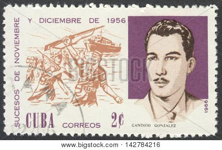 MOSCOW RUSSIA - CIRCA JULY 2016: a post stamp printed in CUBA shows C. Gonzalez and Beach Landing the series 