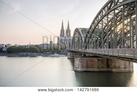 Koln Cityscape With Cathedral And Steel Bridge, Germany