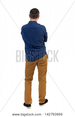Back view of man . Standing young guy. Rear view people collection.  backside view of person.  Isolated over white background.a man in a blue shirt with the sleeves rolled up, standing with her hands