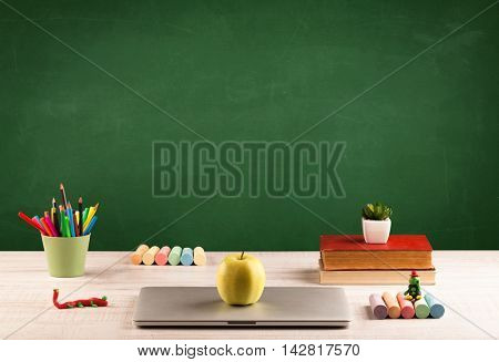 Back to school concepty with clear blackboard background, desk, items