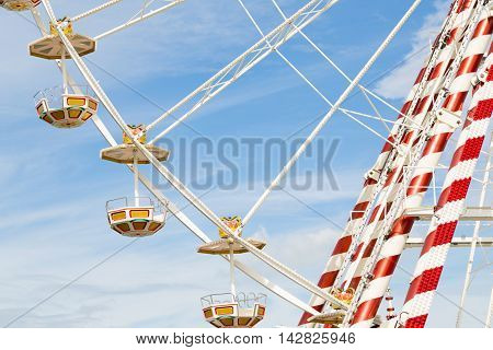 Ferris wheel at an amusement park with blue sky