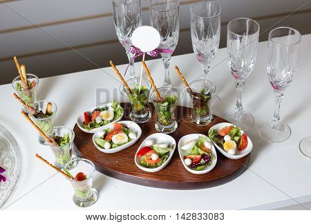 Boiled quail eggs, tomatoes, lettuce. All laid out on beautiful white plates-2