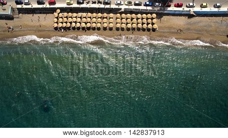 beach with umbrellas from above greece alepochori