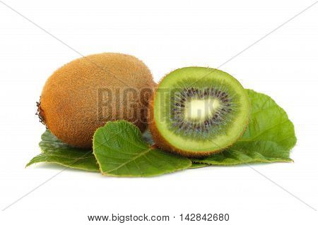 Kiwi fruit and green leaves isolated on white
