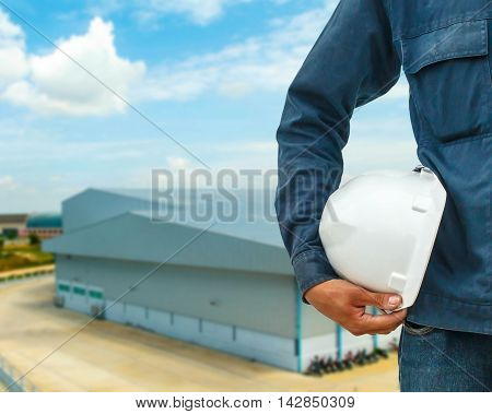 The engineering and safety helmets stood on the details of architectural metal roofing in commercial construction