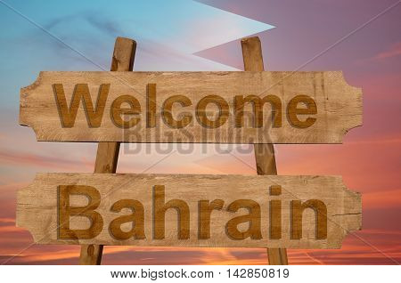 Welcome To  Bahrin Sing On Wood Background With Blending National Flag