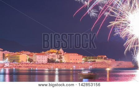 The Ajaccio bay at night during firework for celebration the Assumption and date of birth of Napoleon the 1st French Emperor who was born in Ajaccio Corsica island.