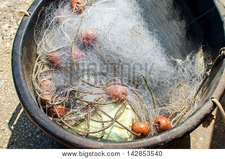 fishing cast net in a circle basket