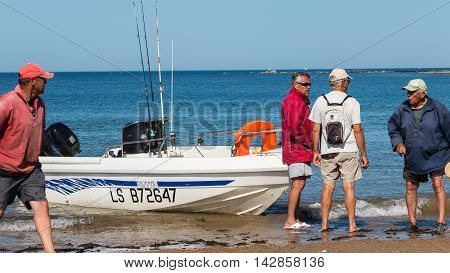 Men Returning From A Sea Fishing Competition