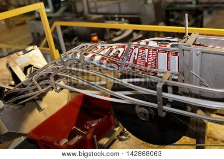 ST. PETERSBURG, RUSSIA - AUGUST 11, 2016: Beer conveyor in the Heineken brewery. In 2003, it was the first Heineken brewery in Russia, and now it can produce over 5 millions HL of beer per year