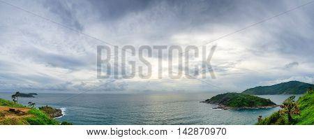 cloudy panoramic cape and sun behind the cloud.
