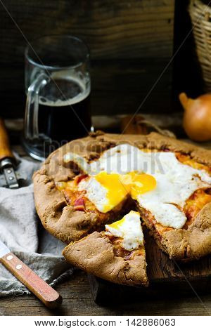 gallet with onion ham and egg . style rustic. selective focus
