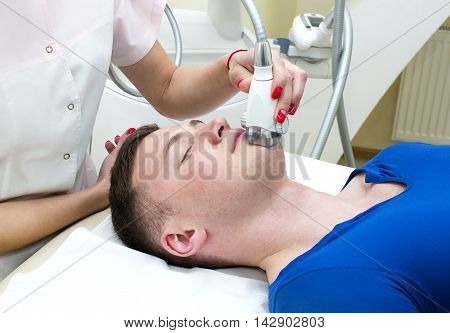 Male is in the process at the clinic lipomassage