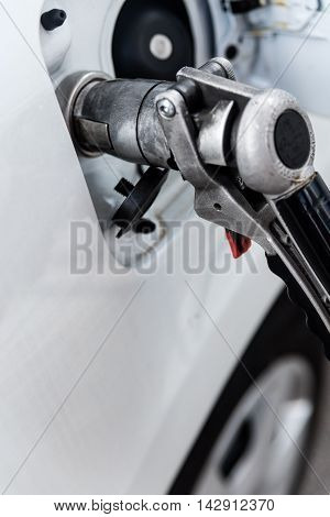 car connected fuel pump nozzle or LPG gas dispenser