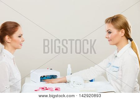 Beautician With Client At Beauty Salon.