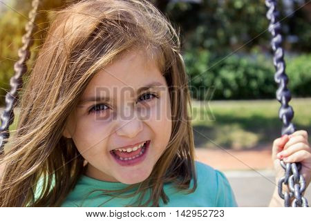 Portrait of a beautiful little girl smiling