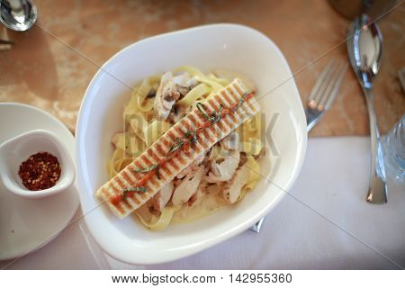 Penne alfredo chicken pasta with pesto sauce