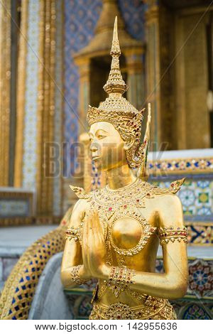 BANGKOK THAILAND - MARCH 9 2016: The statue of Kinnari a half-woman half-bird creature at Wat Phra Kaew in Bangkok Thailand.