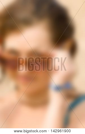 Sexy girl at the beach theme creative abstract blur background with bokeh effect