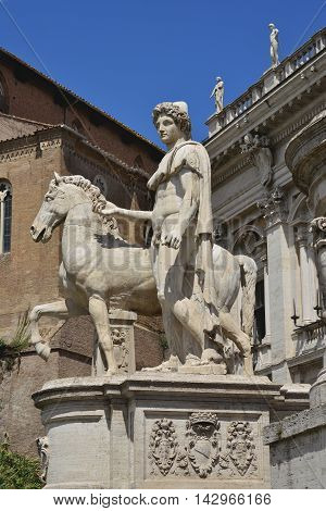 Ancient marble statue of Dioskouri at the top of monumental balustrade in Capitoline Hill Rome