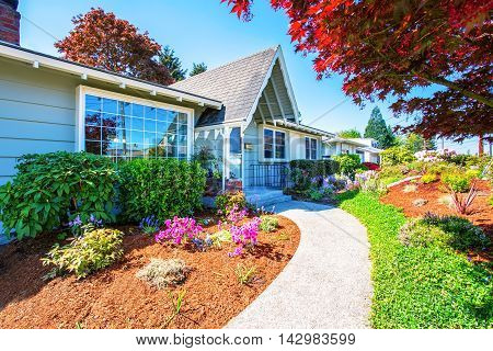 Small Light Blue American House Exterior With French Windows.