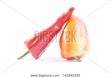 Red hot and sweet peppers isolated on white batskground