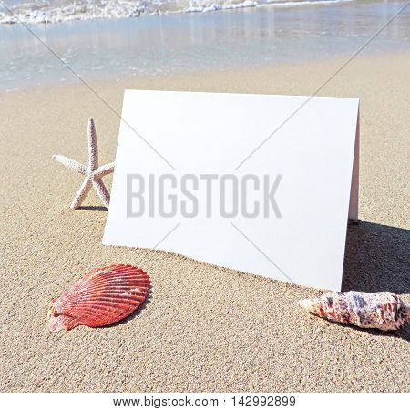 Beach with blank greeting card or business card. Beach background with copy space.