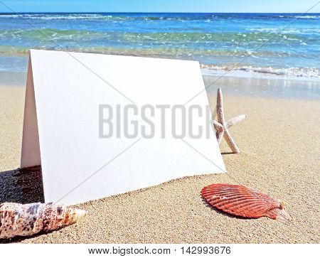 Beach with blank greeting card or business card. Beach background with copy space.