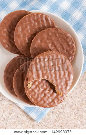 Milk chocolate covered digestive sweetmeal or wholemeal biscuits