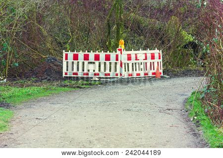 Red Whitepolice Line With Yellow Lettering For Crime Scene Investigation In A Rural Area In The Fore
